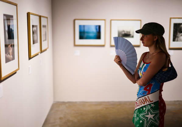 (260709) -- ARLES, July 9, 2026 -- A woman views exhibits during an exhibition at the Rencontres d Arles photography festival in Arles, France, July 8, 2026. The 57th Rencontres d Arles photography festival lasts from July 6 to October 4. ) FRANCE-ARLES-RENCONTRES D ARLES-PHOTOGRAPHY FESTIVAL-EXHIBITION WuxHuiwo 