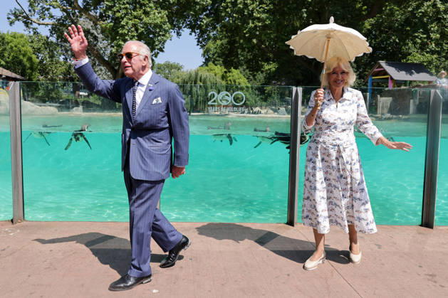 July 9, 2026, London, London, UK: London, UK. King Charles III and Queen Camilla wave to the crowd after observing laser training exercises with Humboldt penguins at Penguin Beach during their visit to London Zoo to mark the 200th anniversary of the Zoological Society of London. London UK - ZUMAl94_ 20260709_zaf_l94_008 Copyright: xDinendraxHariax