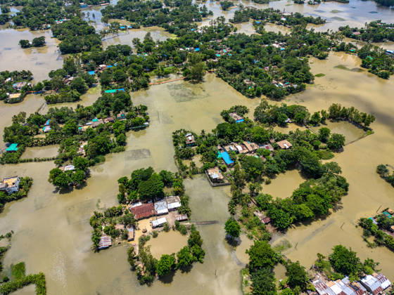 Aftermath Of Floodwaters In Chattogram A drone shot captures clusters of homes isolated like green islands amid massive sheets of standing floodwater in Banshkhali, Chattogram, Bangladesh, on July 14, 2026. Although the flood waters in Banshkhali and Satkania in Chittagong are slowly receding.Many areas are still knee-deep in water, and as the water recedes, collapsed mud houses, damaged structures, destroyed brick kilns and severely damaged agricultural land are becoming visible, displacing thousands of people and leaving them struggling to meet their basic needs. Chattogram Bangladesh  Copyright: xZakirxHossainx originalFilename: hossain-notitle260714_np3ls.jpg