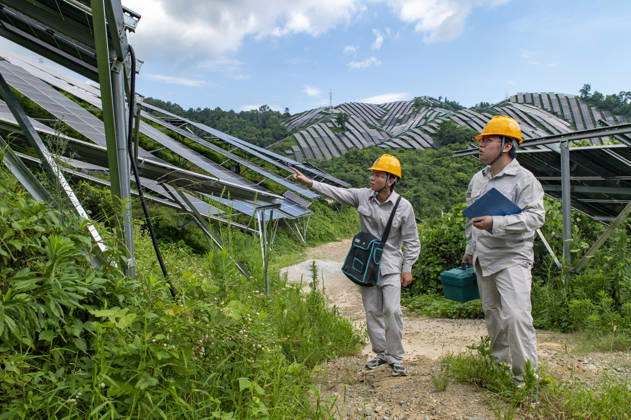 JINHUA, CHINA - JULY 16: Staff members inspect the operation of photovoltaic panels at an agrivoltaic power generation project on July 16, 2026 in Jinhua, Zhejiang Province of China. The project combines agricultural production with photovoltaic power generation to utilize land resources.  Copyright: xVCGx 111654625888