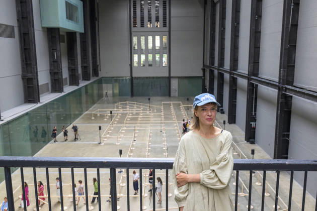 July 24, 2026, London, London, UK: Artist Lina LapelytÄ poses with her created maze-like installation, transforming the Turbine Hall into a collaborative stage. Audiences are invited to co-create in a piece of mass choreography, moving through a grid of wooden barriers. You are also free to quietly watch the performance unfold, from the Turbine Hall bridge. London, UK. London UK  - ZUMAl94_ 20260724_zaf_l94_003 Copyright: xRayxTangx