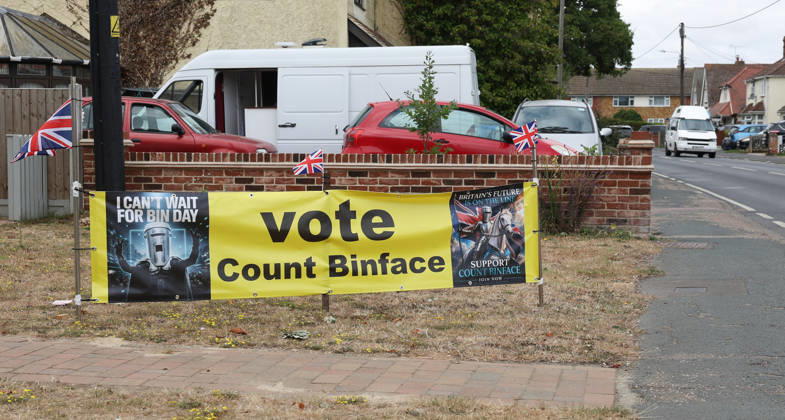 July 26, 2026, Clacton-On-Sea, Essex, UK: Clacton-On-Sea, UK. A large Count Binface campaign banner is displayed outside a house in Kirby Cross, Essex. Nigel Farage has resigned his seat and is now campaigning to be re-elected in the Clacton constituency at the upcoming by-election on the 13th August. Clacton-On-Sea UK  - ZUMAl94_ 20260726_zaf_l94_005 Copyright: xJacquelinexLawriex