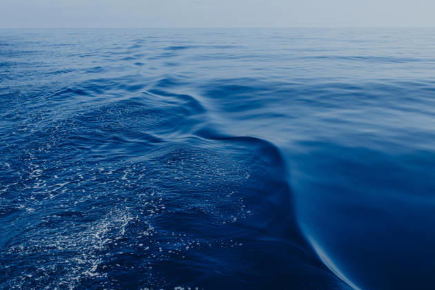 Deep blue sea water creates a wake behind a sailing boat in Ibiza, GMLF02162