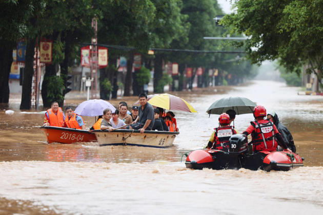 NINGMING, CHINA - AUGUST 23: Residents are evacuated by boat due to flooding caused by a typhoon on August 23, 2026 in Chengzhong Town, Ningming, Guangxi Zhuang Autonomous Region of China. Local authorities organized rescue forces to transfer residents to safe areas.  Copyright: xVCGx 111661654616