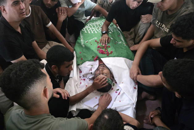 Palestinians Bury Three People in Khan Younis Palestinians attend the funeral of three people in Khan Younis, in the southern Gaza Strip, on August 25, 2026. Two died from wounds sustained in previous Israeli strikes, while the third was killed in an Israeli strike the previous evening. Photo by Tariq Mohammad APA Images Khan Yunis Gaza Strip Palestinian Territory 250826_Khan_Yunis_TM_04(22) Copyright: xapaimagesxTariqxMohammad xapaimagesx