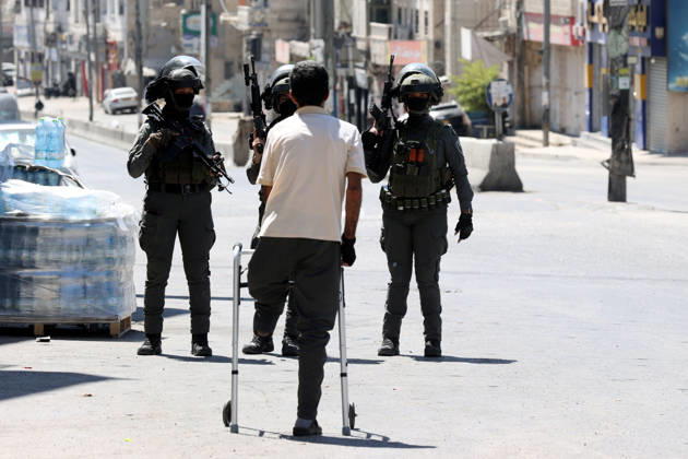 Israeli forces raid UNRWA s Kalendiya Education Center in East Jerusalem JERUSALEM - AUGUST 25 : Israeli forces raid the Qalandia Training Center belonging to the United Nations Relief and Works Agency for Palestine Refugees in the Near East (UNRWA) north of East Jerusalem on August 25, 2026. Israeli forces arrive to evacuate the center block surrounding streets and prevent local residents from approaching. Issam Rimawi Anadolu Jerusalem Palestinian Territory, Occupied. Editorial use only. Please get in touch for any other usage.  Copyright: x2026xAnadoluxIssamxRimawix