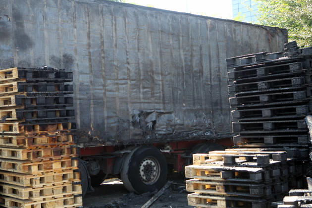 A trailer truck and burnt wooden pallets that caught fire as a result of a nighttime Russian UAV attack are in a parking lot near a shopping and entertainment centre in Dnipro, Ukraine, August 25, 2026. Fires broke out inside and near the shopping mall as a result of the Russian attack. (Photo by Mykola Miakshykov Ukrinform) Russian attack hits parking lot near shopping mall in Dnipro suburb  Copyright: xMykolaxMiakshykovx