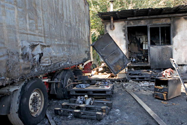 A trailer truck and burnt wooden pallets that caught fire as a result of a nighttime Russian UAV attack are in a parking lot near a shopping and entertainment centre in Dnipro, Ukraine, August 25, 2026. Fires broke out inside and near the shopping mall as a result of the Russian attack. (Photo by Mykola Miakshykov Ukrinform) Russian attack hits parking lot near shopping mall in Dnipro suburb  Copyright: xMykolaxMiakshykovx