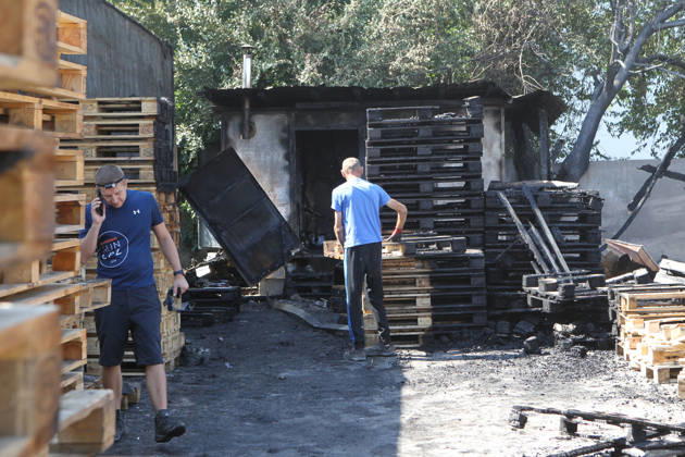 Men work at a parking lot, damaged by a nighttime Russian UAV attack, near a shopping and entertainment centre in Dnipro, Ukraine, August 25, 2026. Fires broke out inside and near the shopping mall as a result of the Russian attack. (Photo by Mykola Miakshykov Ukrinform) Russian attack hits parking lot near shopping mall in Dnipro suburb  Copyright: xMykolaxMiakshykovx