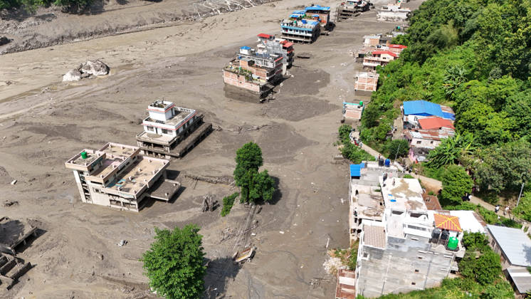 August 26, 2026, Nuwakot, Nepal: An aerial view shows buildings and infrastructure damaged along the swollen Trishuli River following a massive flash flood triggered by an avalanche of ice and rock in the upper Lhende River on the Tibetan side, in Nuwakot district, Nepal, on Wednesday, August 26, 2026. The sudden flood swept through communities along the Bhote Koshi and Trishuli river systems, destroying homes, roads and bridges and leaving widespread devastation downstream. Nuwakot Nepal - ZUMAg200 20260826_zap_g200_007 Copyright: xSkandaxGautamx
