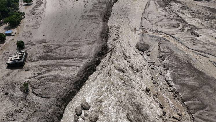 August 26, 2026, Nuwakot, Nepal: An aerial view shows buildings and infrastructure damaged along the swollen Trishuli River following a massive flash flood triggered by an avalanche of ice and rock in the upper Lhende River on the Tibetan side, in Nuwakot district, Nepal, on Wednesday, August 26, 2026. The sudden flood swept through communities along the Bhote Koshi and Trishuli river systems, destroying homes, roads and bridges and leaving widespread devastation downstream. Nuwakot Nepal - ZUMAg200 20260826_zap_g200_008 Copyright: xSkandaxGautamx
