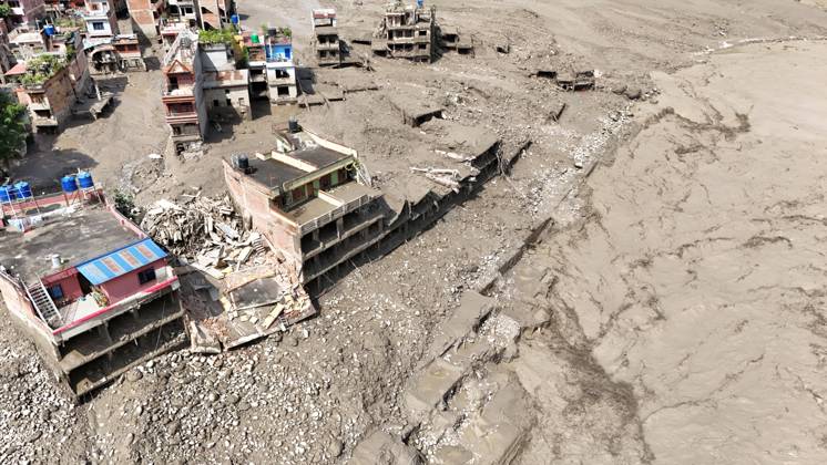 August 26, 2026, Nuwakot, Nepal: An aerial view shows buildings and infrastructure damaged along the swollen Trishuli River following a massive flash flood triggered by an avalanche of ice and rock in the upper Lhende River on the Tibetan side, in Nuwakot district, Nepal, on Wednesday, August 26, 2026. The sudden flood swept through communities along the Bhote Koshi and Trishuli river systems, destroying homes, roads and bridges and leaving widespread devastation downstream. Nuwakot Nepal - ZUMAg200 20260826_zap_g200_010 Copyright: xSkandaxGautamx