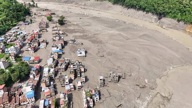 August 26, 2026, Nuwakot, Nepal: An aerial view shows buildings and infrastructure damaged along the swollen Trishuli River following a massive flash flood triggered by an avalanche of ice and rock in the upper Lhende River on the Tibetan side, in Nuwakot district, Nepal, on Wednesday, August 26, 2026. The sudden flood swept through communities along the Bhote Koshi and Trishuli river systems, destroying homes, roads and bridges and leaving widespread devastation downstream. Nuwakot Nepal  - ZUMAg200 20260826_zap_g200_012 Copyright: xSkandaxGautamx