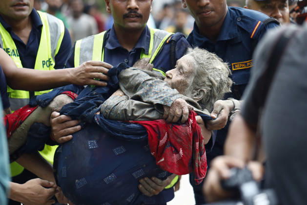 August 26, 2026, Nuwakot, Nepal: An elderly woman is rescued from buildings and infrastructure that were damaged along the swollen Trishuli River following a massive flash flood triggered by an avalanche of ice and rock in the upper Lhende River on the Tibetan side, in Nuwakot district, Nepal, on Wednesday, August 26, 2026. The sudden flood swept through communities along the Bhote Koshi and Trishuli river systems, destroying homes, roads and bridges and leaving widespread devastation downstream. Nuwakot Nepal - ZUMAg200 20260826_zap_g200_016 Copyright: xSkandaxGautamx
