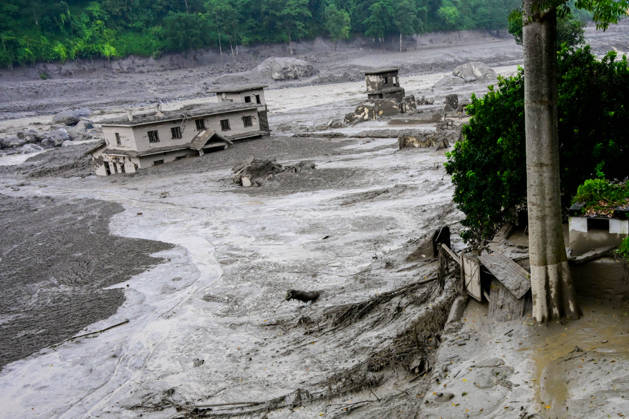 August 26, 2026, Kathmandu, Bagmati, Nepal: NUWAKOT, NEPAL - AUGUST 26: An aftermath view of flash floods and mudslides along the Trishuli River in Nuwakot, Nepal, on August 26, 2026. A catastrophic flash flood swept through Nepalâ€⠢s northern border region after an ice-and-rock avalanche, reportedly triggered by an earthquake, caused a sudden surge in the Lhende River on the Nepal-China border and sent massive volumes of water, mud and debris downstream into the Bhote Koshi and Trishuli river systems. The disaster devastated settlements in Rasuwa and Nuwakot districts, sweeping away homes, roads, bridges, vehicles and other infrastructure and severely damaging hydropower and power facilities. In Nuwakot, riverside settlements includin - ZUMAs330 20260826_zsp_s330_010 Copyright: xSafalxPrakashxShresthax