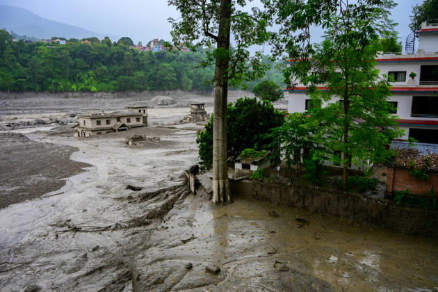 August 26, 2026, Kathmandu, Bagmati, Nepal: NUWAKOT, NEPAL - AUGUST 26: An aftermath view of flash floods and mudslides along the Trishuli River in Nuwakot, Nepal, on August 26, 2026. A catastrophic flash flood swept through Nepalâ€⠢s northern border region after an ice-and-rock avalanche, reportedly triggered by an earthquake, caused a sudden surge in the Lhende River on the Nepal-China border and sent massive volumes of water, mud and debris downstream into the Bhote Koshi and Trishuli river systems. The disaster devastated settlements in Rasuwa and Nuwakot districts, sweeping away homes, roads, bridges, vehicles and other infrastructure and severely damaging hydropower and power facilities. In Nuwakot, riverside settlements includin - ZUMAs330 20260826_zsp_s330_007 Copyright: xSafalxPrakashxShresthax