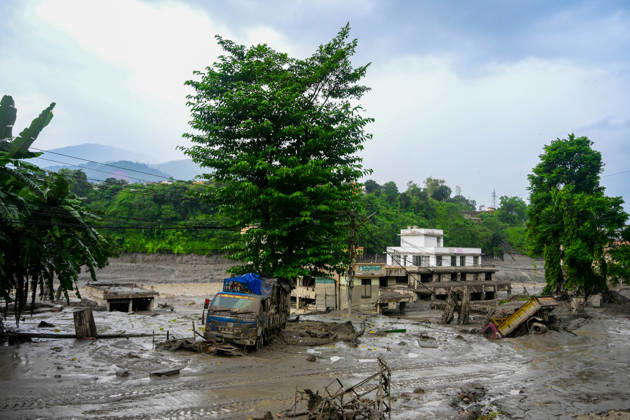 August 26, 2026, Kathmandu, Bagmati, Nepal: NUWAKOT, NEPAL - AUGUST 26: An aftermath view of flash floods and mudslides along the Trishuli River in Nuwakot, Nepal, on August 26, 2026. A catastrophic flash flood swept through Nepalâ€⠢s northern border region after an ice-and-rock avalanche, reportedly triggered by an earthquake, caused a sudden surge in the Lhende River on the Nepal-China border and sent massive volumes of water, mud and debris downstream into the Bhote Koshi and Trishuli river systems. The disaster devastated settlements in Rasuwa and Nuwakot districts, sweeping away homes, roads, bridges, vehicles and other infrastructure and severely damaging hydropower and power facilities. In Nuwakot, riverside settlements includin - ZUMAs330 20260826_zsp_s330_066 Copyright: xSafalxPrakashxShresthax