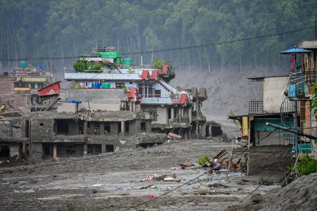 August 26, 2026, Nuwakot, Bagmati, Nepal: NUWAKOT, NEPAL - AUGUST 26, 2026: An aftermath view of flash floods and mudslides along the Trishuli River. A catastrophic flash flood swept through NepalÃ¢â‚¬â ¢s northern border region after an ice-and-rock avalanche, reportedly triggered by an earthquake, caused a sudden surge in the Lhende River on the Nepal-China border and sent massive volumes of water, mud and debris downstream into the Bhote Koshi and Trishuli river systems. The disaster devastated settlements in Rasuwa and Nuwakot districts, sweeping away homes, roads, bridges, vehicles and other infrastructure and severely damaging hydropower and power facilities. In Nuwakot, riverside settlements including Trishuli Bazaar, Devighat, Betr - ZUMAq101 20260826_zna_q101_060 Copyright: xSafalxPrakashxShresthax