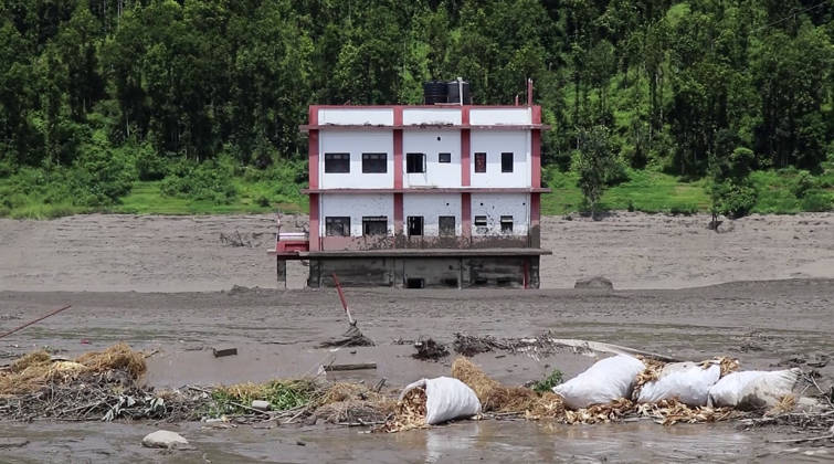 RECORD DATE NOT STATED Flash flood ravages Nepal™s Rasuwa Rasuwa Nepal , Aug 26 (ANI): A building partially submerged in mud-laden floodwaters following a flash flood caused by an outburst in the Bhotekoshi River, in Rasuwa on Wednesday. Around 105 Indians among the foreign nationals reported missing after the flash flood. (RSS Nepal ANI Video Grab) Rasuwa Nepal Copyright: xANIx ANI_20260826309