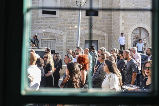 Palestinians Mourn Artist Sliman Mansour Mourners gather outside a church during the funeral of renowned Palestinian artist Sliman Mansour in Birzeit, north of Ramallah, in the occupied West Bank, on August 26, 2026. Mansour, one of the most prominent figures in contemporary Palestinian visual art, died on August 24 at the age of 79 and was known for works depicting Palestinian landscapes, heritage and life under Israeli occupation, including his 1973 painting Camel of Hardships. Ramallah West Bank Palestinian Territories Copyright: xMohammadxNazzalx