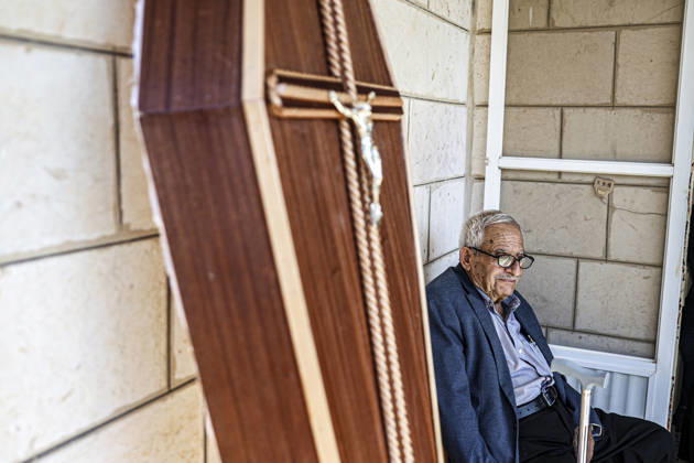 Palestinians Mourn Artist Sliman Mansour An elderly mourner sits near the funeral gathering for renowned Palestinian artist Sliman Mansour in Birzeit, north of Ramallah, in the occupied West Bank, on August 26, 2026. Mansour, one of the most prominent figures in contemporary Palestinian visual art, died on August 24 at the age of 79 and was known for works depicting Palestinian landscapes, heritage and life under Israeli occupation, including his 1973 painting Camel of Hardships. Ramallah West Bank Palestinian Territories Copyright: xMohammadxNazzalx