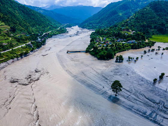 Drone View Shows Bhotekoshi Flood Damage to Homes and Infrastructure in Nuwakot Nepal Nuwakot, Nepal - August 26, 2026: Aerial view shows flooding along the Bhotekoshi River affecting low-lying areas along the riverbanks and nearby residences in Nuwakot, Nepal. The flooding has caused widespread damage to homes, roads, bridges, and other infrastructure in the area, while several people remain missing and the number of casualties is still being assessed. (Photo by AP Tolang Nexpher Images) Nuwakot bagmati