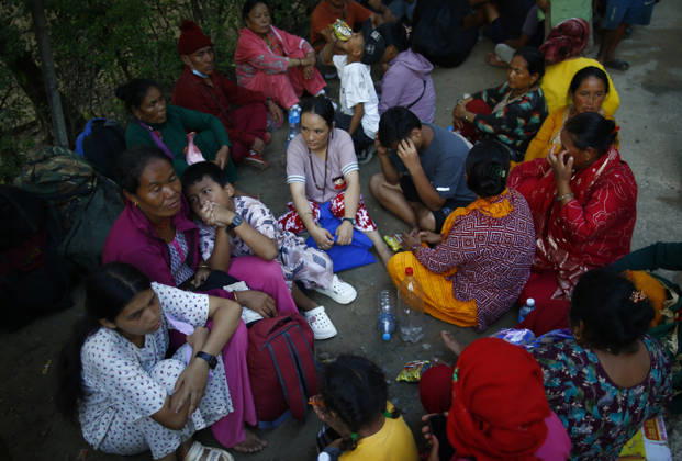 August 27, 2027, Nuwakot, Nepal: People wait to receive news of their family and friends outside the army camp following flash floods at Devighat in Bidur Municipality, Nuwakot district, Nepal, on Thursday, August 27, 2026. The floods, triggered by a glacial collapse and debris flow upstream, have killed at least 270 people and left 826 others out of contact, according to Nepalese authorities, with search and rescue operations continuing. Nuwakot Nepal - ZUMAg200 20270827_zap_g200_003 Copyright: xSkandaxGautamx