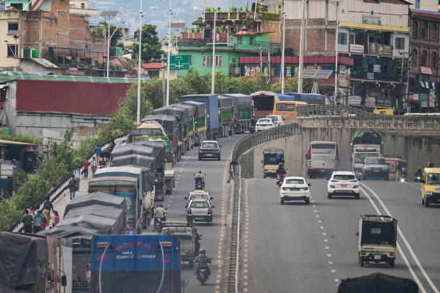 August 27, 2026, Kathmandu, Bagmati, Nepal: Trucks and other vehicles remain stranded along the Kalankiâ€Thankotâ€Nagdhunga route in Kathmandu, Nepal, on August 27, 2026, as major highways remain closed following devastating flash floods and landslides. The stranded vehicles have occupied multiple lanes along the road, causing traffic congestion and further disrupting movement in the area. The floods swept through Rasuwa and other parts of central Nepal before surging downstream along the Trishuli and Narayani river systems, damaging roads, bridges, settlements and other infrastructure. The Nagdhungaâ€Muglin route, a key road connection between Kathmandu and other parts of the country, has been closed, disrupting the movem - ZUMAs330 20260827_zsp_s330_014 Copyright: xSafalxPrakashxShresthax