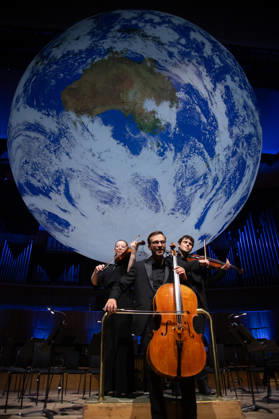 Luke Jerram s Earth Installation GAIA Suspended over Royal Festival Hall Stage at Royal Festival Hall, London, UK - Thursday 27 August 2026 A General view of GAIA by Luke Jerram with members of the BBC Concert Orchestra at Royal Festival Hall, London, England, UK on Thursday 27 August, 2026. The Installation runs from Friday 28th August - 30th August 2026 and Orchestral performances from the BBC Concert Orchestra will take place on Friday 28th and Saturday 29th August 2026., Credit:Justin Ng Avalon UK, England, London, Royal Festival Hall Copyright: xJustinxNgx xAvalonx 1128810185