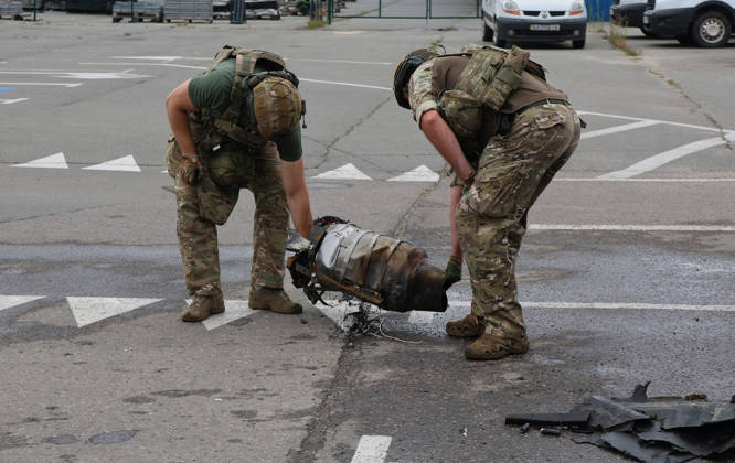 Forensic experts carry a fragment of a Russian drone used to attack an Epicenter hypermarket in the Osnovianskyi district of Kharkiv, Ukraine, August 27, 2026. A 40-year-old man was killed, and four others were injured in the strike. (Photo by Viacheslav Madiievskyi Ukrinform) Russian drone attacks home improvement hypermarket in Kharkiv  Copyright: xViacheslavxMadiievskyix