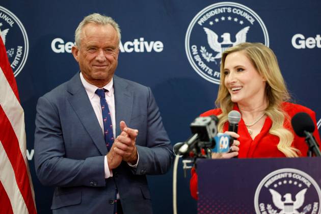 August 27, 2026, Tampa, Florida, USA: Rep. Laurel Lee, R-Tampa, right, speaks, while U.S. Secretary of Health and Human Services Robert F. Kennedy, Jr. applauds during the Presidential Fitness Test event at Gaither High School on Thursday, Aug. 27, 2026, in Tampa. Tampa USA - ZUMAs70_ 20260827_zan_s70_020 Copyright: xJeffereexWoox