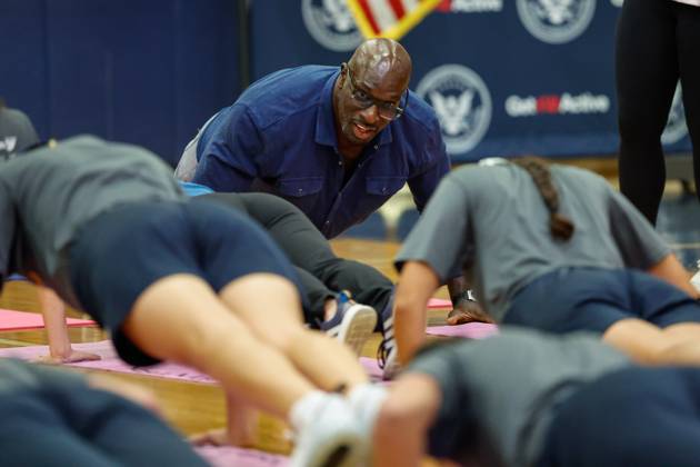 August 27, 2026, Tampa, Florida, USA: Thaddeus Bullard, a WWE Hall of Famer, does push ups with students during the Presidential Fitness Test event at Gaither High School on Thursday, Aug. 27, 2026, in Tampa. Tampa USA  - ZUMAs70_ 20260827_zan_s70_024 Copyright: xJeffereexWoox