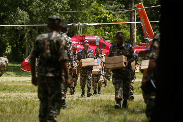 Nepal Disaster: The Second Day Of Devastation, Rescue And Recovery Security personnel unload relief supplies from a helicopter in Nuwakot, Nepal, on August 27, 2026, following an outburst of a glacial lake in Tibet. Emergency teams continue rescue and relief operations in flood-affected areas, providing essential supplies to stranded and displaced residents. Nuwakot Nepal  Copyright: xSanjitxPariyarx originalFilename: pariyar-notitle260827_npzkS.jpg