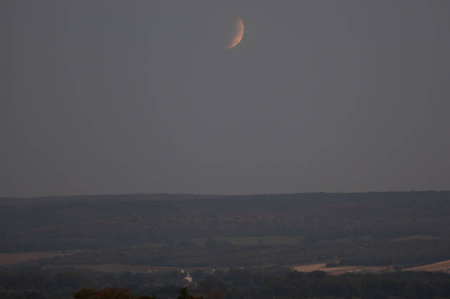 Partial lunar eclipse observed from Northern Hungary ZSUJTA, HUNGARY - AUGUST 28: A partial lunar eclipse, caused by the Moon passing through Earth s shadow, is observed above a tiny village of Zsujta, Hungary, on August 28, 2026. Robert Nemeti Anadolu Zsujta Hungary. Editorial use only. Please get in touch for any other usage. Copyright: x2026xAnadoluxRobertxNemetix