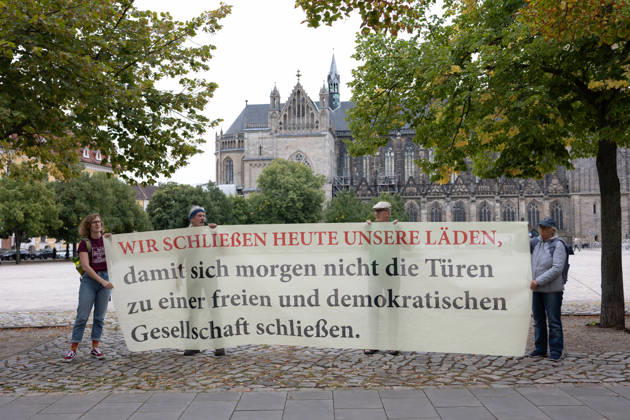 Migra-Streik rally against racism and social exclusion in Germany s Magdeburg MAGDEBURG, GERMANY - AUGUST 27: Business owners, organizers and supporters take part in a rally against racism and social exclusion outside the Saxony-Anhalt state parliament at Domplatz in Magdeburg, Germany, on August 27, 2026. The rally was held as part of the Migra-Streik, during which participating migrant-run businesses across Magdeburg voluntarily closed from 10 a.m. to 3 p.m. to call for solidarity and the protection of a free and democratic society, ahead of Saxony-Anhalt s state election on September 6. Somaya Abdelrahman Anadolu Magdeburg Germany. Editorial use only. Please get in touch for any other usage.  Copyright: x2026xAnadoluxSomayaxAbdelrahmanx