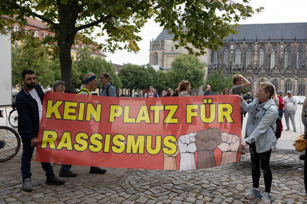 Migra-Streik rally against racism and social exclusion in Germany s Magdeburg MAGDEBURG, GERMANY - AUGUST 27: Business owners, organizers and supporters take part in a rally against racism and social exclusion outside the Saxony-Anhalt state parliament at Domplatz in Magdeburg, Germany, on August 27, 2026. The rally was held as part of the Migra-Streik, during which participating migrant-run businesses across Magdeburg voluntarily closed from 10 a.m. to 3 p.m. to call for solidarity and the protection of a free and democratic society, ahead of Saxony-Anhalt s state election on September 6. Somaya Abdelrahman Anadolu Magdeburg Germany. Editorial use only. Please get in touch for any other usage.  Copyright: x2026xAnadoluxSomayaxAbdelrahmanx