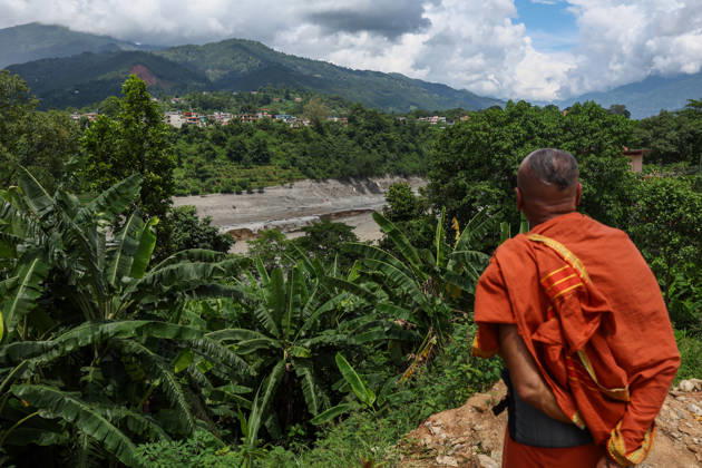 Nepal-China flash flood death toll rises to at least 469, hundreds remain missing NUWAKOT, NEPAL - AUGUST 28: A monk surveys a lake expected to overflow following an earthquake, amid the aftermath of landslide and flash floods in areas near the Nepal-China border, in Bidur, Nuwakot, Nepal, on August 28, 2026. Death toll from the disaster has so far risen to at least 469, with hundreds of people missing, including foreign nationals from 32 countries such as China, Malaysia, South Korea, Australia, the United Kingdom, India and the United States. Daniel Ceng Anadolu Nuwakot Nepal. Editorial use only. Please get in touch for any other usage. Copyright: x2026xAnadoluxDanielxCengx