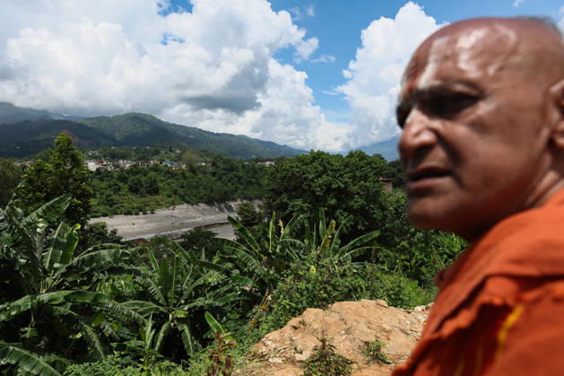 Nepal-China flash flood death toll rises to at least 469, hundreds remain missing NUWAKOT, NEPAL - AUGUST 28: A monk surveys a lake expected to overflow following an earthquake, amid the aftermath of landslide and flash floods in areas near the Nepal-China border, in Bidur, Nuwakot, Nepal, on August 28, 2026. Death toll from the disaster has so far risen to at least 469, with hundreds of people missing, including foreign nationals from 32 countries such as China, Malaysia, South Korea, Australia, the United Kingdom, India and the United States. Daniel Ceng Anadolu Nuwakot Nepal. Editorial use only. Please get in touch for any other usage. Copyright: x2026xAnadoluxDanielxCengx