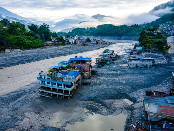 August 28, 2026, Nuwakot, Bagmati, Nepal: NUWAKOT, NEPAL †AUGUST 28, 2026: An aerial view shows the aftermath of severe flooding along the Bhotekoshi River in Nuwakot, Nepal. The flooding affected low-lying areas and settlements near the riverbanks, causing widespread damage to homes, roads, bridges, a hydropower station and other infrastructure. Several people remain missing as authorities continue to assess the extent of the disaster. Rescue teams and security personnel are conducting search and rescue operations in the affected areas. Nuwakot Nepal - ZUMAq101 20260828_zna_q101_122 Copyright: xAmbirxTolangx