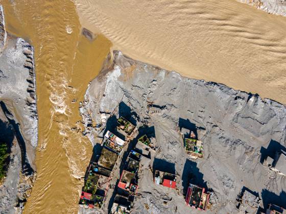 August 28, 2026, Nuwakot, Bagmati, Nepal: NUWAKOT, NEPAL †AUGUST 28, 2026: An aerial view shows the aftermath of severe flooding along the Bhotekoshi River in Nuwakot, Nepal. The flooding affected low-lying areas and settlements near the riverbanks, causing widespread damage to homes, roads, bridges, a hydropower station and other infrastructure. Several people remain missing as authorities continue to assess the extent of the disaster. Rescue teams and security personnel are conducting search and rescue operations in the affected areas. Nuwakot Nepal - ZUMAq101 20260828_zna_q101_124 Copyright: xAmbirxTolangx