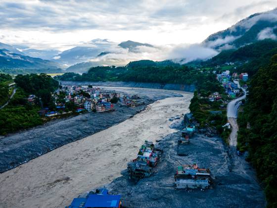 August 28, 2026, Nuwakot, Bagmati, Nepal: NUWAKOT, NEPAL †AUGUST 28, 2026: An aerial view shows the aftermath of severe flooding along the Bhotekoshi River in Nuwakot, Nepal. The flooding affected low-lying areas and settlements near the riverbanks, causing widespread damage to homes, roads, bridges, a hydropower station and other infrastructure. Several people remain missing as authorities continue to assess the extent of the disaster. Rescue teams and security personnel are conducting search and rescue operations in the affected areas. Nuwakot Nepal - ZUMAq101 20260828_zna_q101_130 Copyright: xAmbirxTolangx