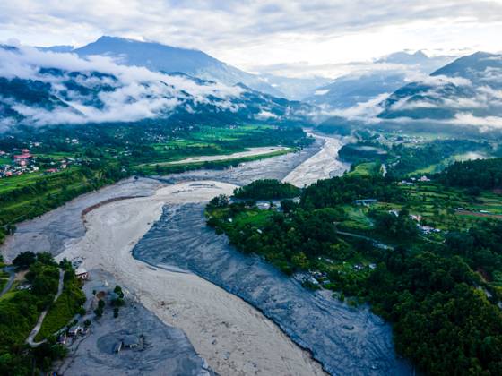 August 28, 2026, Nuwakot, Bagmati, Nepal: NUWAKOT, NEPAL †AUGUST 28, 2026: An aerial view shows the aftermath of severe flooding along the Bhotekoshi River in Nuwakot, Nepal. The flooding affected low-lying areas and settlements near the riverbanks, causing widespread damage to homes, roads, bridges, a hydropower station and other infrastructure. Several people remain missing as authorities continue to assess the extent of the disaster. Rescue teams and security personnel are conducting search and rescue operations in the affected areas. Nuwakot Nepal - ZUMAq101 20260828_zna_q101_129 Copyright: xAmbirxTolangx