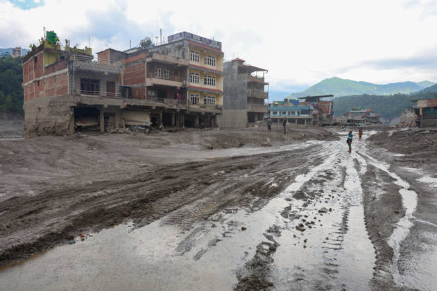 Nepal-China flash flood death toll rises to at least 469, hundreds remain missing NUWAKOT, NEPAL - AUGUST 28: People walk in the midst of collapsed and damaged houses covered in muds, following landslide and flash floods in areas near the Nepal-China border, in Nuwakot, Nepal, on August 28, 2026. Death toll from the disaster has so far risen to at least 469, with hundreds of people missing, including foreign nationals from 32 countries such as China, Malaysia, South Korea, Australia, the United Kingdom, India and the United States. Daniel Ceng Anadolu Nuwakot Nepal. Editorial use only. Please get in touch for any other usage. Copyright: x2026xAnadoluxDanielxCengx
