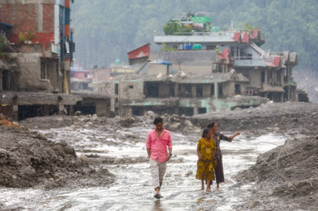 Nepal-China flash flood death toll rises to at least 469, hundreds remain missing NUWAKOT, NEPAL - AUGUST 28: Residents walk in the midst of muds and debris of collapsed houses, following landslide and flash floods in areas near the Nepal-China border, in Nuwakot, Nepal, on August 28, 2026. Death toll from the disaster has so far risen to at least 469, with hundreds of people missing, including foreign nationals from 32 countries such as China, Malaysia, South Korea, Australia, the United Kingdom, India and the United States. Daniel Ceng Anadolu Nuwakot Nepal. Editorial use only. Please get in touch for any other usage. Copyright: x2026xAnadoluxDanielxCengx