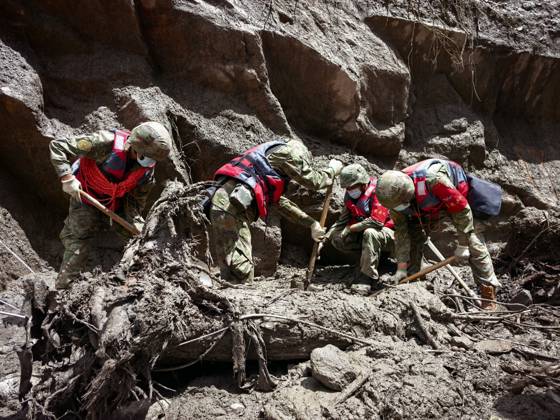 (260828) -- GYIRONG, Aug. 28, 2026 -- Rescuers from the Chinese People s Liberation Army work in a mudslide-hit area near Gyirong Port in Gyirong County, in Xigaze, southwest China s Xizang Autonomous Region, Aug. 28, 2026. The death toll had risen to five and 558 remained missing as of 3 p.m. on Friday after a mudslide struck the Gyirong Port along the China-Nepal border in southwest China s Xizang Autonomous Region, according to the region s emergency management department. Rescuers are operating around the clock in mudslide-affected areas near the Gyirong Port. (Photo by Liu Yuqin Xinhua) (SpotNews) CHINA-XIZANG-XIGAZE-MUDSLIDE-RESCUE (CN) LiuxFang 