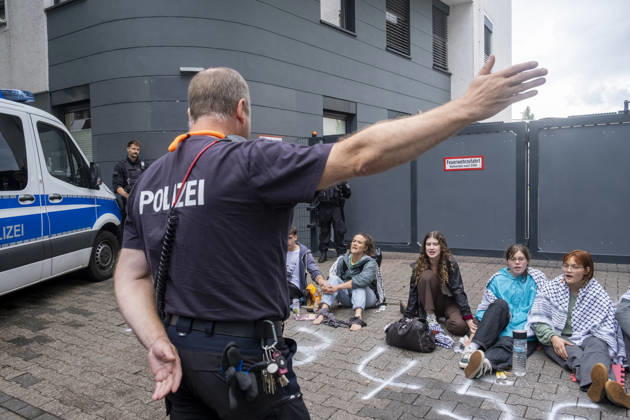 Protest against Rheinmetall in Germany BONN, GERMANY - AUGUST 28: Activists block the entrance to a Rheinmetall facility during a protest against the German arms manufacturer in Bonn, Germany, on August 28, 2026. Demonstrators staged the blockade as part of a nationwide mobilization protesting Rheinmetall’s involvement in the defense industry and its supply of military equipment amid the war in Gaza. Several participants glued themselves to the ground, prompting police to deploy a technical unit during a six-hour operation that ended with the arrest and detention of all blockade participants. Mouafak Mahmalji Anadolu Bonn Germany. Editorial use only. Please get in touch for any other usage.  Copyright: x2026xAnadoluxMouafakxMahmaljix