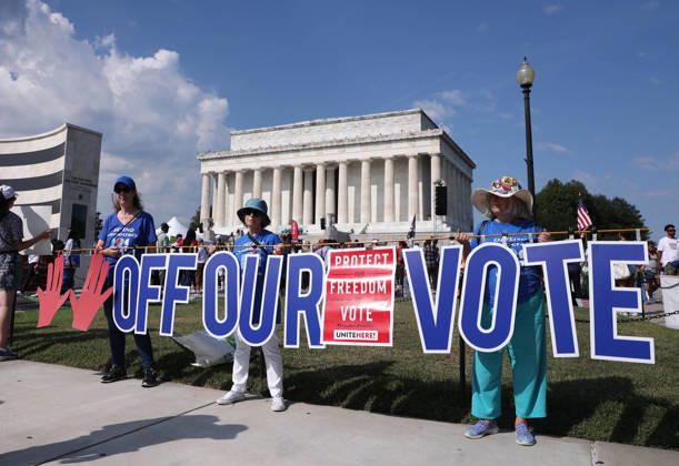 August 28, 2026, Washington, District Of Columbia, USA: People hold signs as they attend a Defend the Vote rally near the Lincoln Memorial in Washington, DC, USA, on August 28, 2026, coinciding with the 63rd anniversary of the 1963 March on Washington rally for civil rights. The march comes just weeks before the November midterm elections, with organisers using the demonstration to mobilise voters and make voting rights a central issue in the campaign. Washington USA - ZUMAs337 20260828_znp_s337_005 Copyright: xGentxShkullakux