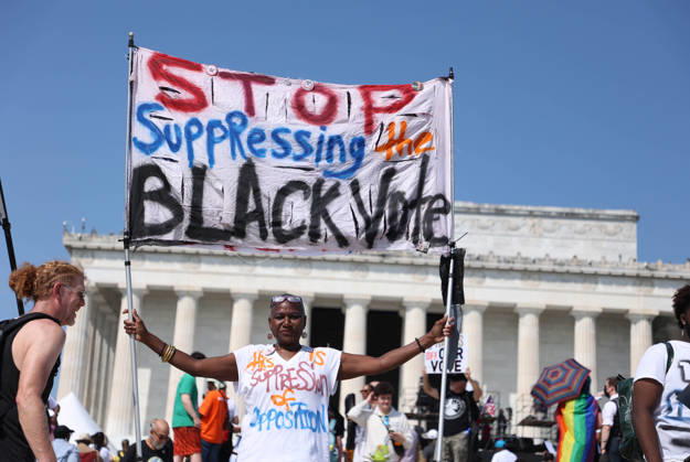 August 28, 2026, Washington, District Of Columbia, USA: People hold signs as they attend a Defend the Vote rally near the Lincoln Memorial in Washington, DC, USA, on August 28, 2026, coinciding with the 63rd anniversary of the 1963 March on Washington rally for civil rights. The march comes just weeks before the November midterm elections, with organisers using the demonstration to mobilise voters and make voting rights a central issue in the campaign. Washington USA - ZUMAs337 20260828_znp_s337_020 Copyright: xGentxShkullakux