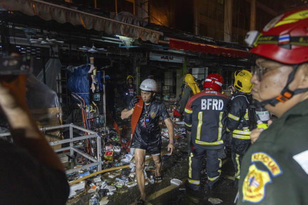 Bangkok Fire Engulfs Klongthom Centre Firefighters and rescue workers move through debris and damaged shopfronts inside the market complex during firefighting operations at Klongthom Centre on Worachak Road in Pom Prap Sattru Phai, Bangkok, Thailand, on August 28, 2026. The fire was reported at 8:42 p.m. at Klongthom Centre on Worachak Road, where flames spread from a ground-floor shop across the ground floor and mezzanine beneath the parking area; parts of the structure subsided, several emergency personnel were injured, and firefighters brought the blaze under control at about 11:15 p.m. Bangkok Bangkok Thailand Copyright: xNicolaxLongobardix
