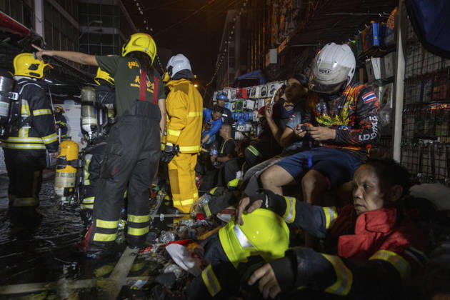 Bangkok Fire Engulfs Klongthom Centre Firefighters and rescue workers gather around an exhausted emergency worker seated amid debris inside the market complex at Klongthom Centre on Worachak Road in Pom Prap Sattru Phai, Bangkok, Thailand, on August 28, 2026. The fire was reported at 8:42 p.m. at Klongthom Centre on Worachak Road, where flames spread from a ground-floor shop across the ground floor and mezzanine beneath the parking area; parts of the structure subsided, several emergency personnel were injured, and firefighters brought the blaze under control at about 11:15 p.m. Bangkok Bangkok Thailand Copyright: xNicolaxLongobardix
